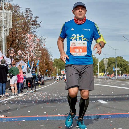 September 15, 2019 Minsk Belarus Close-up of an athlete crossing the finish line of the Minsk half marathonのeditorial素材