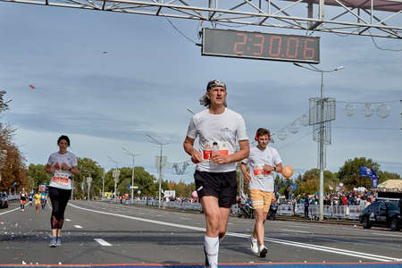 September 15, 2019 Minsk Belarus A marathon race in which participants cross the finish line on a city roadのeditorial素材