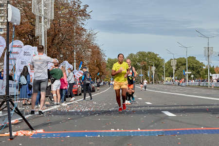 September 15, 2019 Minsk Belarus Competitors run to the finish of the marathon on a city roadのeditorial素材