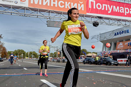 September 15, 2019 Minsk Belarus A marathon race in which a close-up of an active woman crossed the finish lineのeditorial素材