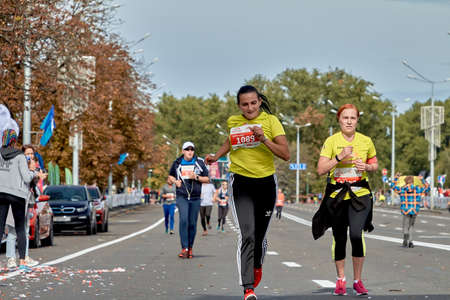 September 15, 2019 Minsk Belarus A marathon race in which two active female competitors run along a city roadのeditorial素材
