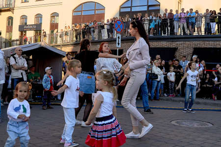 June 1, 2019 Minsk Belarus Street concert where teenage girls dance next to dancing childrenのeditorial素材