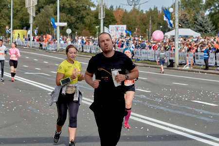 September 15, 2019 Minsk Belarus Close-up of marathon participants running on a city roadのeditorial素材