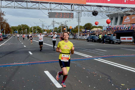 September 15, 2019 Minsk Belarus A marathon race in which a happy woman crossed the finish lineのeditorial素材