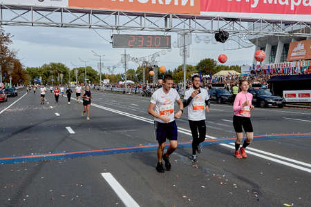 September 15, 2019 Minsk Belarus A marathon race in which three athletes cross the finish lineのeditorial素材