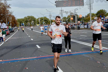 September 15, 2019 Minsk Belarus A marathon race in which athletes cross the finish line on a city roadのeditorial素材