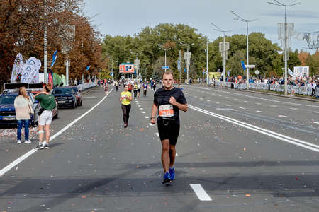 September 15, 2019 Minsk Belarus An athlete runs on the city road of the marathonのeditorial素材