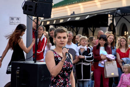 May 25, 2019 Minsk Belarus A young beautiful actress with a microphone is going to sing at a theater performanceのeditorial素材