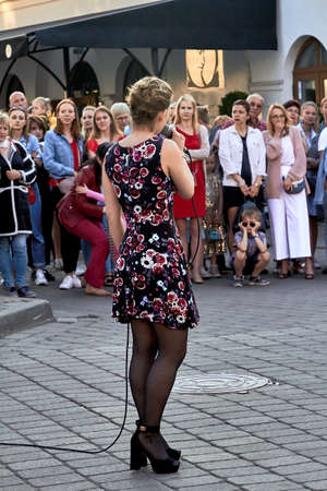 May 25, 2019 Minsk Belarus A street concert in which a young woman with a microphone singsのeditorial素材