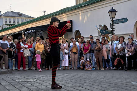 May 25, 2019 Minsk Belarus Girl actress shows theatrical performance with a red ball at the street.のeditorial素材