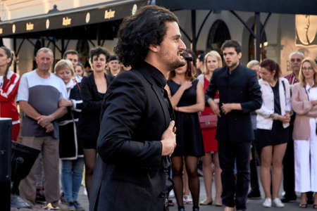 May 25, 2019 Minsk Belarus Actor in black shows performance on the street.のeditorial素材