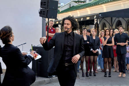 May 25, 2019 Minsk Belarus Actors in black show performance at a street concertのeditorial素材