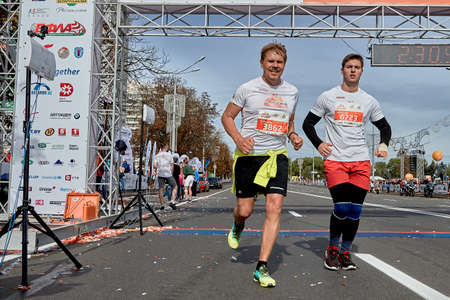 September 15, 2019 Minsk Belarus A marathon race in which two competitors crossed the finish line on a city roadのeditorial素材