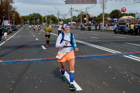 September 15, 2019 Minsk Belarus A marathon race in which an active, happy woman crossed the finish lineのeditorial素材