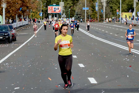 September 15, 2019 Minsk Belarus A woman runs ahead of the participants of the half marathon in Minsk.Healthy lifestyleのeditorial素材