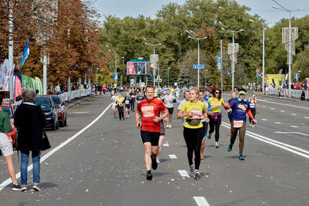 September 15, 2019 Minsk Belarus Marathon participants run along the city road to the finish lineのeditorial素材