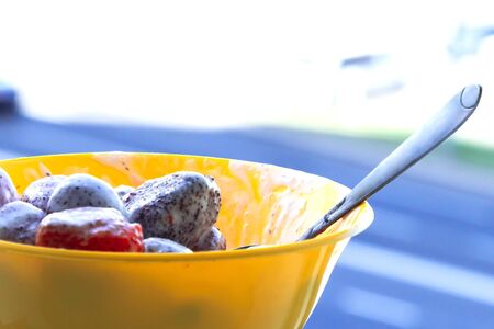 Fresh strawberries in sour cream. Vitamin breakfastの写真素材