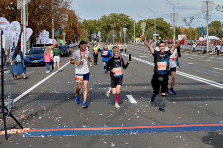 September 15, 2019 Minsk Belarus Minsk hosts a half-marathon in which happy athletes run to the finish line with their hands upのeditorial素材