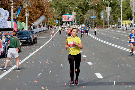 September 15, 2019 Minsk Belarus A woman runs ahead of the participants of the half marathon in Minsk.のeditorial素材