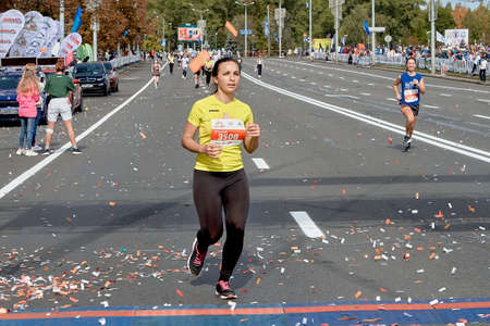 September 15, 2019 Minsk Belarus Minsk hosts a half marathon race in which a beautiful woman runs to the finish lineのeditorial素材