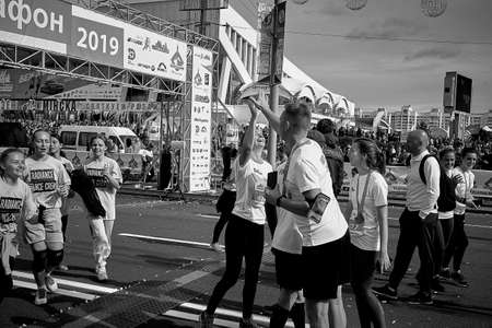 September 15, 2019 Minsk Belarus Half marathon takes place in Minsk, happy participants celebrate after crossing the finish lineのeditorial素材