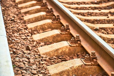 Railway sleepers and rails close-up. Iron bolts and connections. Railway background. Railway crossing.の写真素材