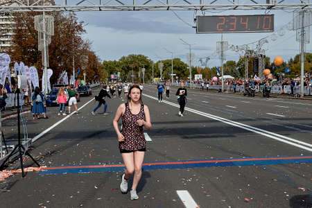 September 15, 2019 Minsk Belarus An active woman crossed the finish line of the marathon in Minskのeditorial素材