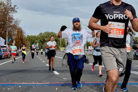 September 15, 2019 Minsk Belarus An athlete with a beard crosses the finish line among the competitorsのeditorial素材