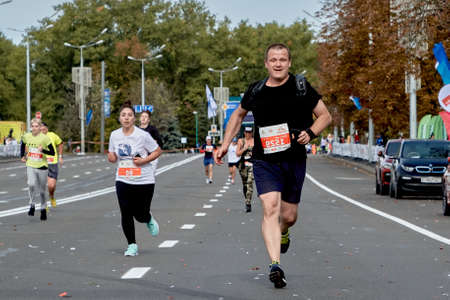 September 15, 2019 Minsk Belarus Minsk hosts a half-marathon where an athlete runs to the finish lineのeditorial素材