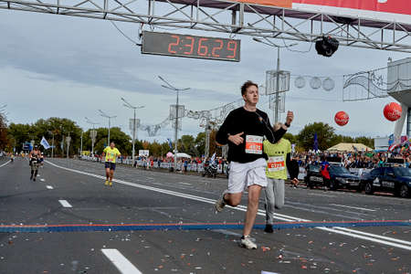 September 15, 2019 Minsk Belarus A marathon race in which an athlete with headphones crosses the finish lineのeditorial素材