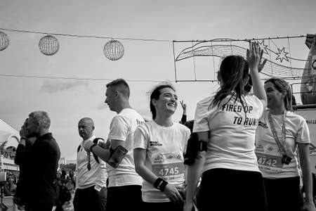 September 15, 2019 Minsk Belarus In black and white the runners participating in the race are very happy to show all their strength during the race and celebrate their arrival in Minskのeditorial素材