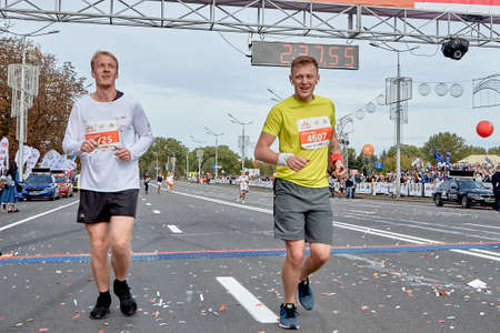 September 15, 2019 Minsk Belarus A half marathon is taking place in Minsk where two lucky people cross the finish line in close upのeditorial素材