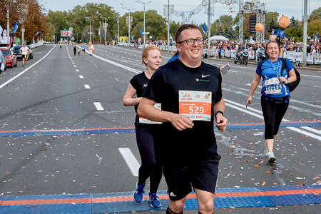 September 15, 2019 Minsk Belarus A marathon race in which close-ups of happy participants cross the finish lineのeditorial素材