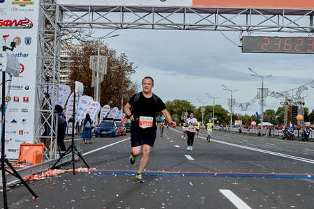 September 15, 2019 Minsk Belarus Minsk hosts a half-marathon where an athlete crosses the finish lineのeditorial素材