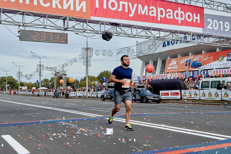 September 15, 2019 Minsk Belarus A marathon race in which a participant crosses the finish line on a city roadのeditorial素材