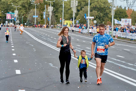 September 15, 2019 Minsk Belarus Minsk hosts a half marathon where a happy family runs along a city roadのeditorial素材
