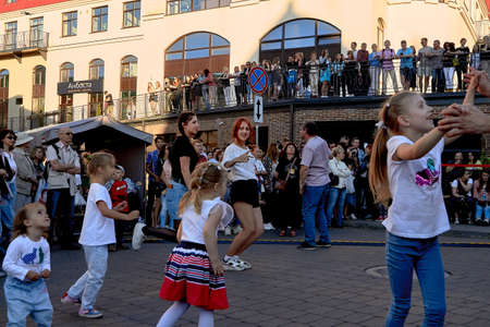 June 1, 2019 Minsk Belarus A street concert where little girls and teenage girls dance in front of a crowd of peopleのeditorial素材
