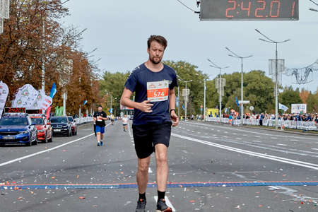 September 15, 2019 Minsk Belarus A marathon race in which an athlete crosses the finish line on a road in a cityのeditorial素材