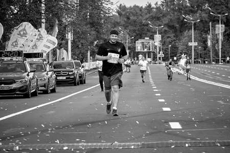 September 15, 2019 Minsk Belarus A marathon race in which a participant runs to the finish line on a road in a cityのeditorial素材