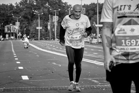 September 15, 2019 Minsk Belarus A black-and-white image of a marathon race in which an elderly...