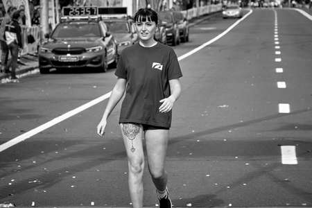 September 15, 2019 Minsk Belarus A marathon race in which a beautiful young woman runs along a city road.Black and white imageのeditorial素材