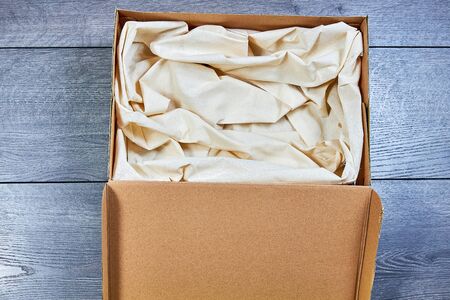 There's a box inside with a white cloth for a pet or gift.Sleeping place for petの写真素材