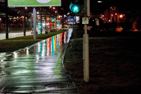 There is a wet street after the night rainの写真素材