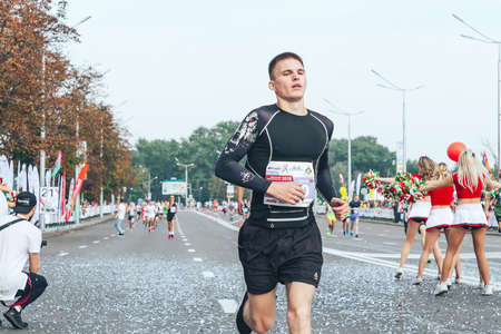 September 9, 2018 Minsk Belarus Half Marathon Minsk 2018 Close up of an active athlete running a marathonのeditorial素材