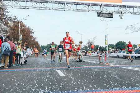September 9, 2018 Minsk Belarus Half Marathon Minsk 2018 A marathon race in which a marathon participant crosses the finish line ahead of the athletesのeditorial素材