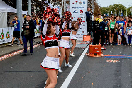 September 15, 2019 Minsk Belarus There are happy girls dancing before the start of the marathonのeditorial素材