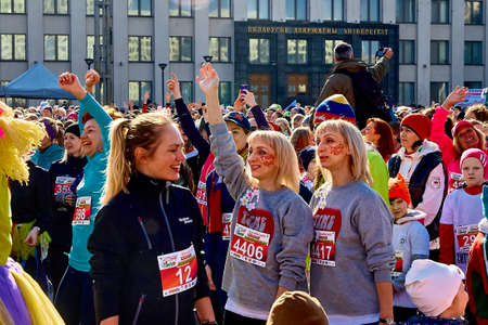 March 8, 2019 Minsk Belarus Women's Day Race on March 8 There are happy women with their hands up at a concertのeditorial素材