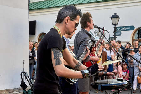 June 1, 2019 Close-up of three musicians playing at a street concert
