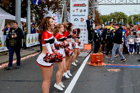 September 15, 2019 Minsk Belarus There are happy beautiful girls dancing before the start of the marathonのeditorial素材