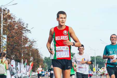 September 9, 2018 Minsk Belarus A marathon race in which a close-up of a marathon runner crosses the finish line ahead of the participantsのeditorial素材